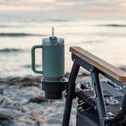 a insulated cup in a beach chair cup holder