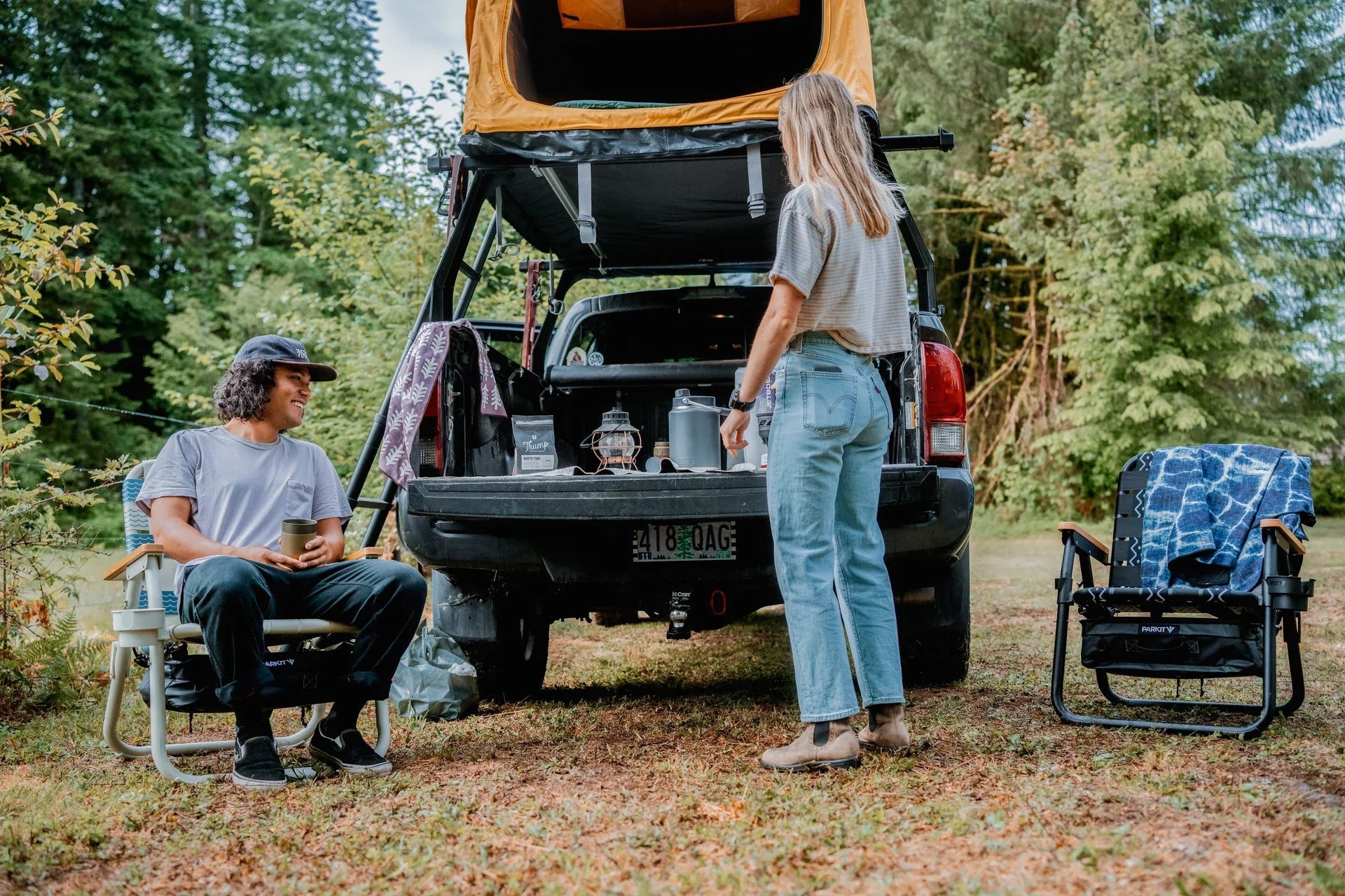 Friends gathered outdoors at a campsite, starting the new year together outside