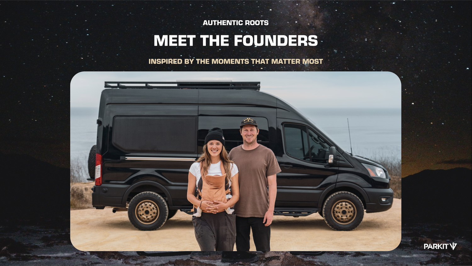 PARKIT founders Steven and Lauren Wilcox stand in front of a black adventure van by the coast, holding their baby, representing the brand’s authentic outdoor roots.