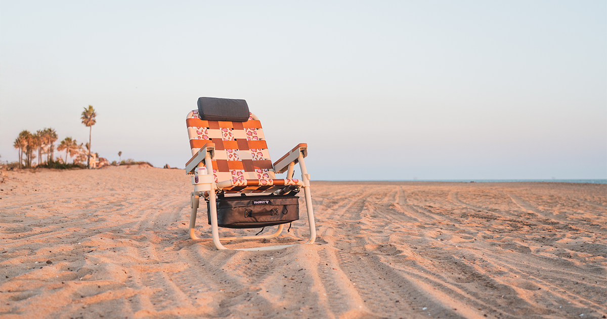 WILD 4 BOOBIES Eclipse Recliner chair on sandy beach, breast cancer awareness collaboration