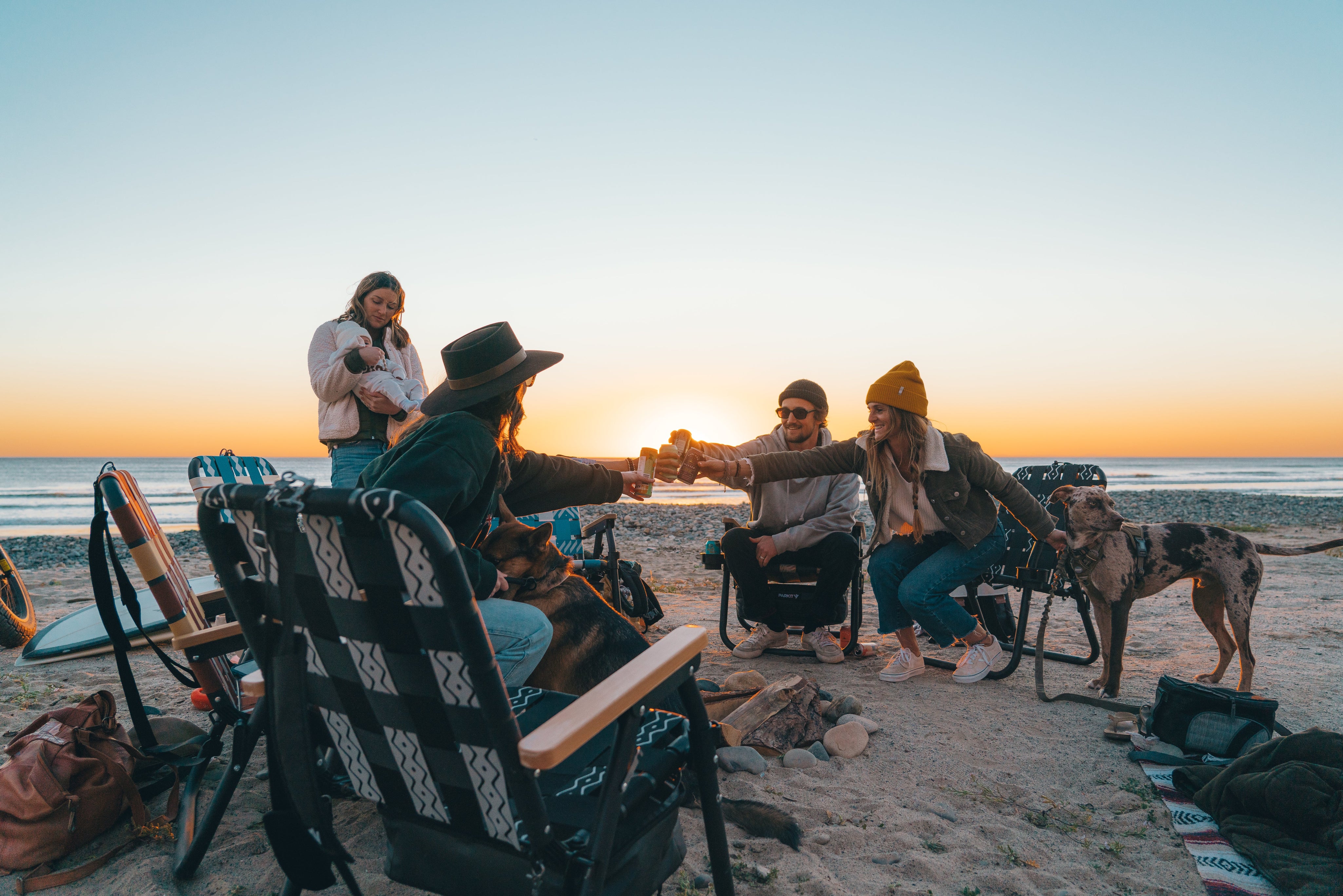 PARKIT community gathered around Voyager chairs at sunset, celebrating early investors and the growing outdoor movement