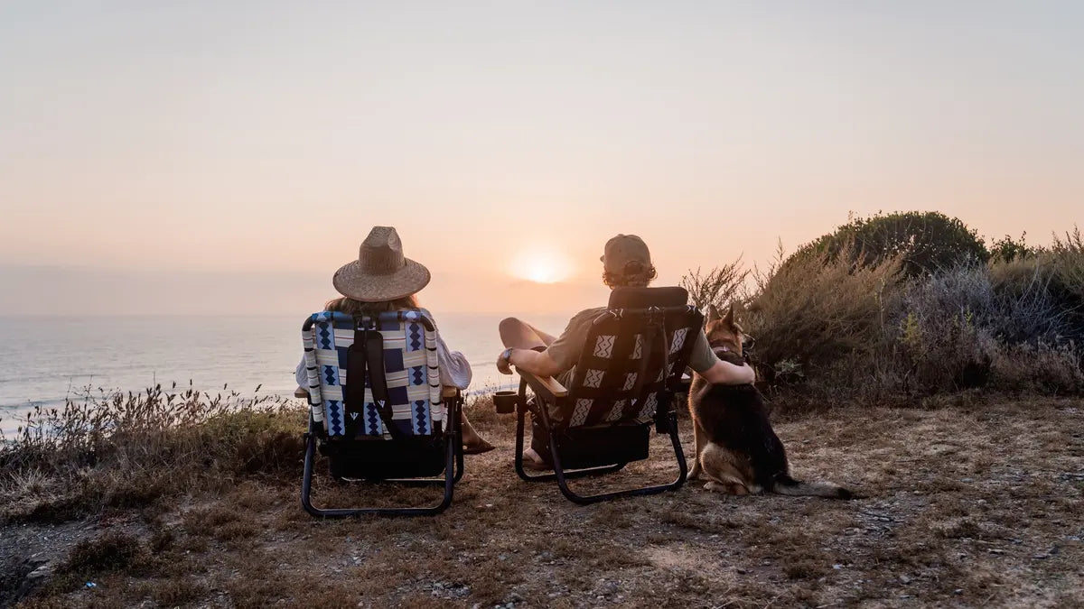 Couple enjoying a Valentine’s Day moment outdoors in comfortable chairs