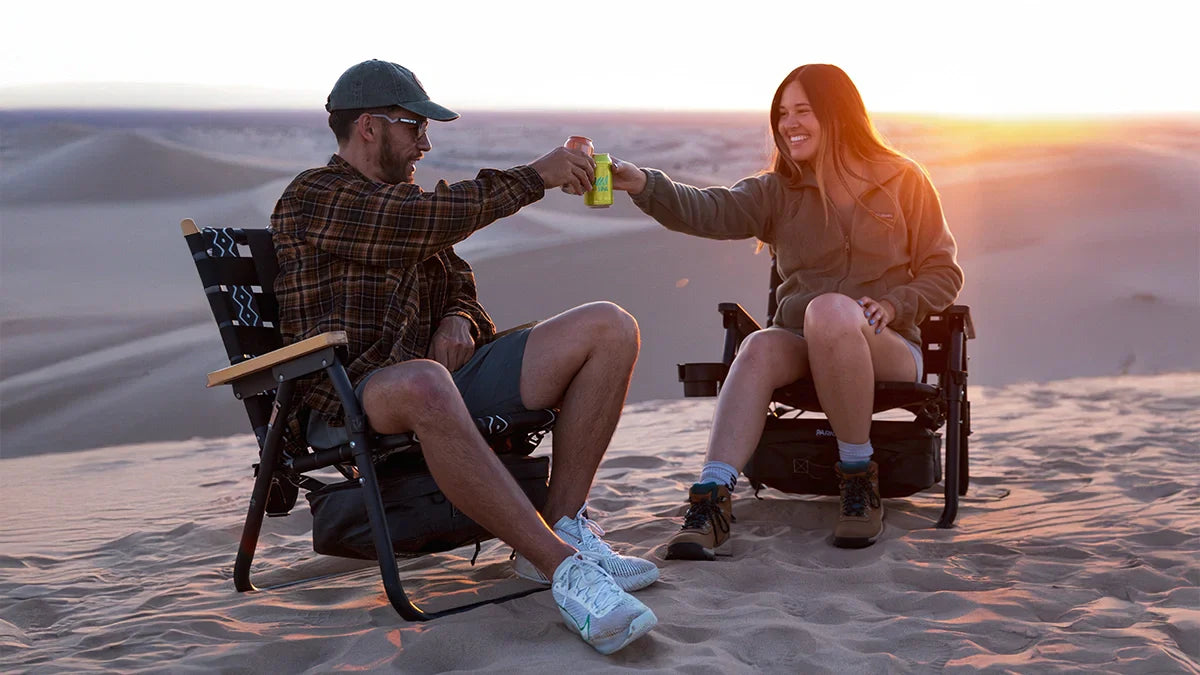 Couple sitting outdoors together in PARKIT chairs on Valentine’s Day