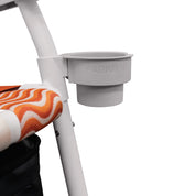 White cup holder attached to a white chair with 'PARKIT' branding.