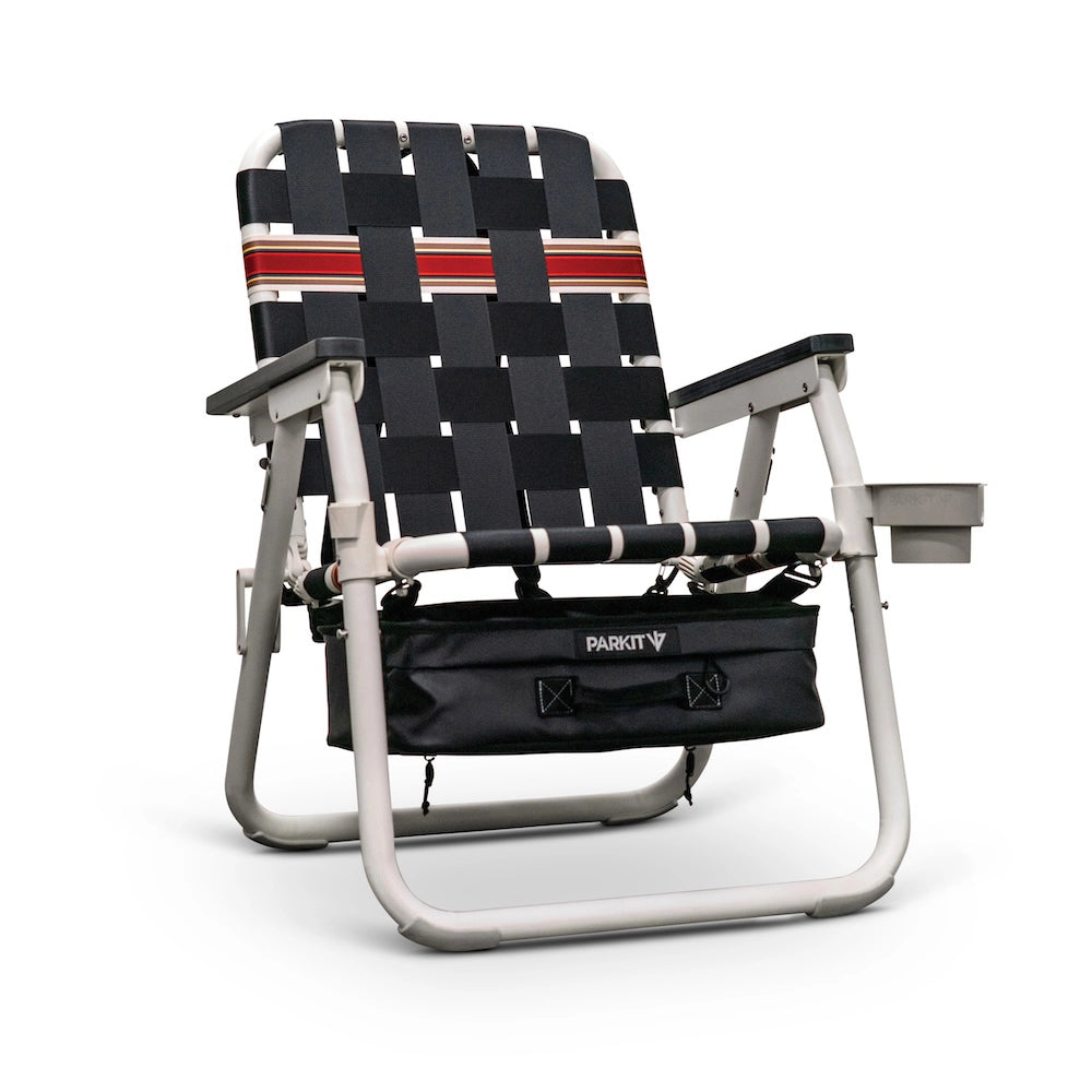 Foldable chair with black and red woven backrest on a white background