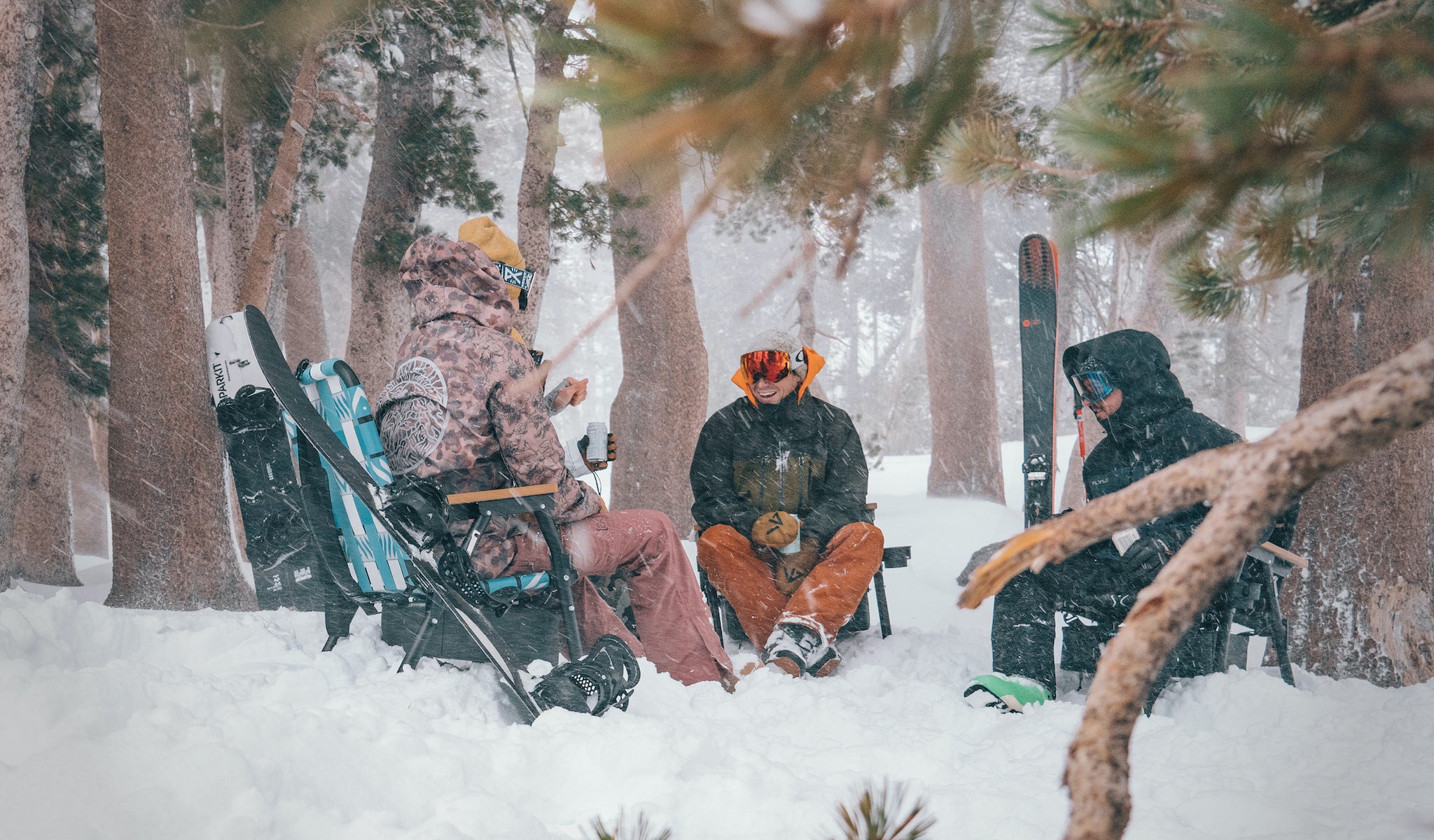 A group of friends sitting in their parkit voyager outdoor chairs in the snow around lake mary near mammoth lakes california
